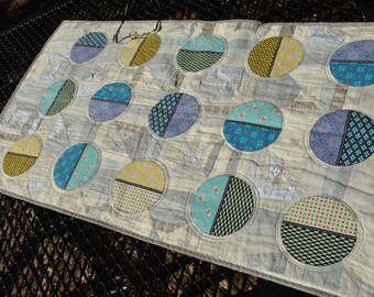Modern Handmade Circles on a Handmade Tablerunner in Neutrals