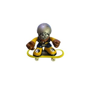 May include: A silver and black figure skater toy with a yin yang design on their shoes, riding a yellow skateboard with black wheels.