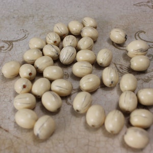 Vintage Lucite Antique Ivory 12mm Oval Bead (24 Pieces)