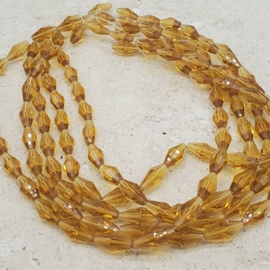 Topaz Bohemian Glass 8mm x 4mm Lantern Beads. (1 strand) (52 beads)