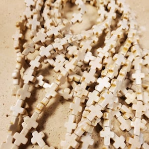 16&quot; strand 10mm cream color cross howlite stone beads (1 strand)