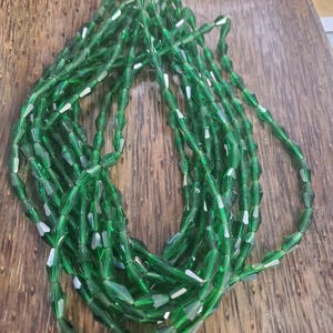 Dark Emerald Bohemian Glass 12mm x 6mm Lantern Beads. (1 strand) (33 beads)