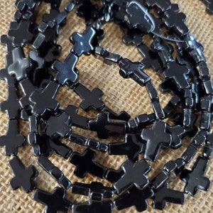 15" strand 16mm black cross  stone beads (1 strand)