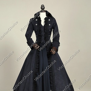 May include: A black Victorian-style dress with a long skirt and a fitted bodice. The dress has a ruffled collar and a long jacket with a similar design. The jacket has a high collar and a row of buttons down the front.