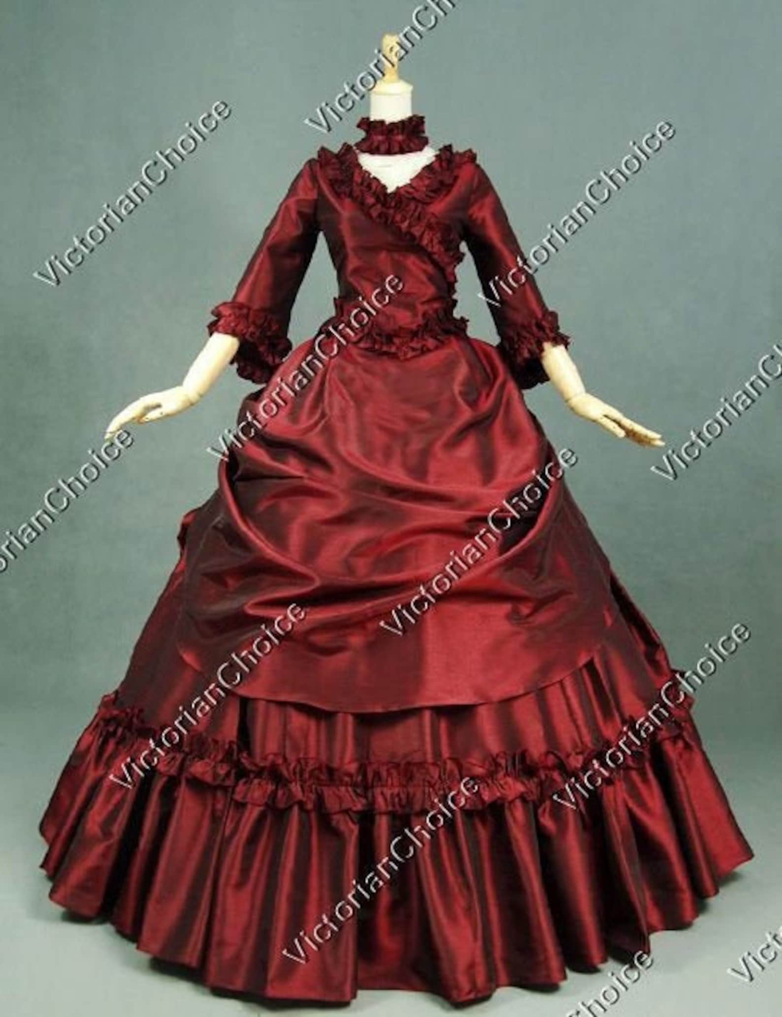 A red victorian dress on a mannequin.
