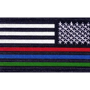 May include: An embroidered patch with a thin blue line, thin red line, and thin green line on a black background. The patch features a white American flag with 50 stars.