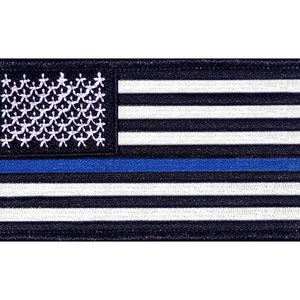 May include: A black and white American flag patch with a thin blue line across the middle. The patch is embroidered and has a black border.