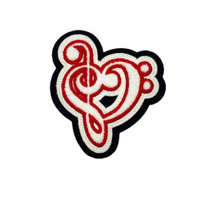 May include: A red and white embroidered iron-on patch shaped like a heart with a treble clef inside. The patch has a black outline.