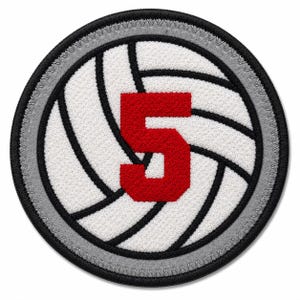 May include: A circular embroidered patch featuring a white volleyball design with black seams and a prominent red number 5 in the center. The patch has a grey inner border and a thick black outer edge with a stitched finish around the perimeter.