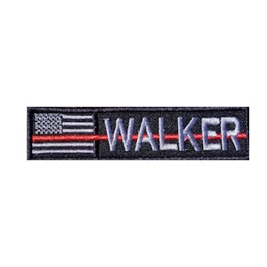 May include: Black and gray embroidered patch with a red line across the middle. The patch features a small American flag on the left side and the word "WALKER" in white on the right side.