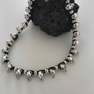 extraordinary beaded skull necklace, simple necklace design with little skull heads, perfect gift idea, original design handmade myDemimore