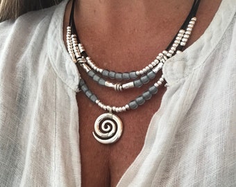 NWT Uno de 50 Silvertone/Leather Necklace w/ Two Resin Stones 17" Happy Go Lucky NWT Uno de 50 Silvertone/Leather Necklace w/ Two Resin Stones 17" Happy Go Lucky