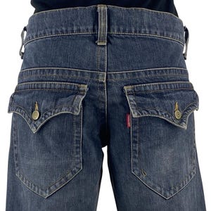 パンツ Tornado mart emo print flare denim pants Tornado Mart Japan Distressed Japan Style Jeans Denim Blue