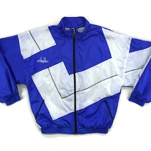 Könnte beinhalten: Eine blaue und weiße Windjacke mit einem schwarzen Reißverschluss und dem Schriftzug "unisport" auf der Vorderseite.
