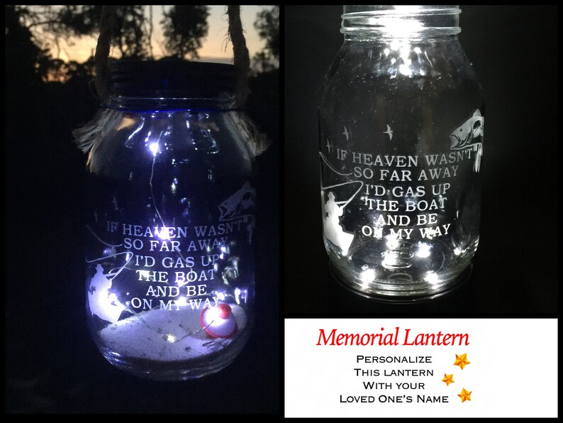 May include: A glass jar lantern with a white silhouette of a fisherman and the text "If heaven wasn't so far away I'd gas up the boat and be on my way". The jar is lit with white LED lights and has a red fishing bobber at the bottom. The text "Memorial Lantern" is below the jar with stars and the text "Personalise this lantern with your loved one's name".