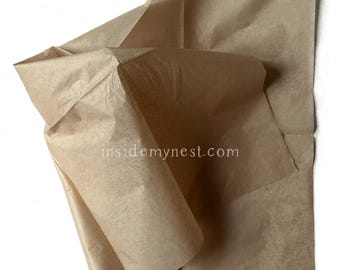 May include: A close-up shot of crumpled brown packing paper. The paper is folded and layered, creating a textured appearance. The image is set against a white background. The website address "insidemynest.com" is visible.