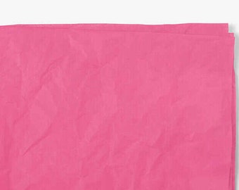 May include: A sheet of pink tissue paper, slightly crumpled, with a smooth, even texture.
