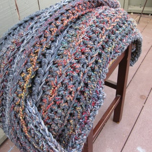 Crochet blanket in gray and rainbow