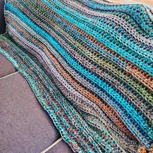 Crochet blanket in teals ,grays, aqua, greens and golds