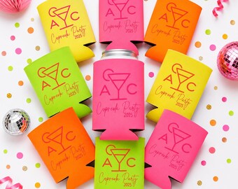 May include: A collection of nine colorful foam can coolers in shades of yellow, lime green, orange, and hot pink. Each cooler features a printed graphic of a martini glass with the letters A, C, and the text Cupreek Party 2025 in red ink.