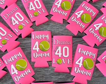 May include: A collection of bright pink foam can coolers featuring tennis-themed birthday designs. Each cooler displays the text Diana is up 40 LOVE or Happy 40th Diana with a graphic of a yellow-green tennis ball replacing the number zero.