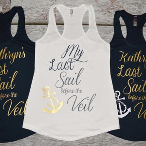 May include: Three tank tops with a nautical theme. The white tank top says "My Last Sail Before the Veil" with a gold anchor. The two navy blue tank tops say "Kathryn's Last Sail Before the Veil" with a white anchor.