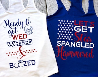 May include: A white racerback tank top with blue and red text reading Ready to get WED WHITE & BOOZED with a beer mug and ring icon, and a blue racerback tank top with white stars and red and white text reading LET'S GET Star SPANGLED Hammered.