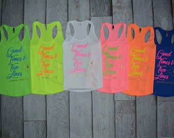 May include: Six tank tops in different colors with the text "Good Times & Tan Lines" and a silhouette of the state of Texas with a cactus inside. The text is in a gold color and the silhouette is in a green color.