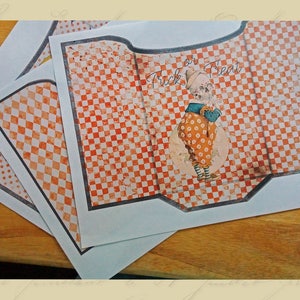 May include: Three printable Halloween treat bags with a checkered orange and white pattern. The center bag features a skeleton dressed as a jester with the text "Trick or Treat".