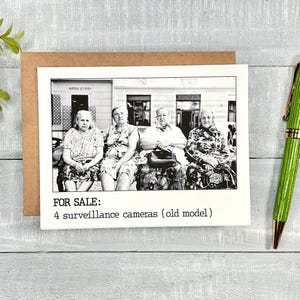 May include: Black and white photo of four older women sitting on a bench outside. The photo is captioned "FOR SALE: 4 surveillance cameras (old model)"