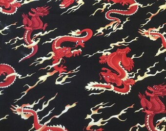 May include: Red and gold dragons on a black background. The dragons are depicted in a traditional Chinese style, with swirling flames and clouds.