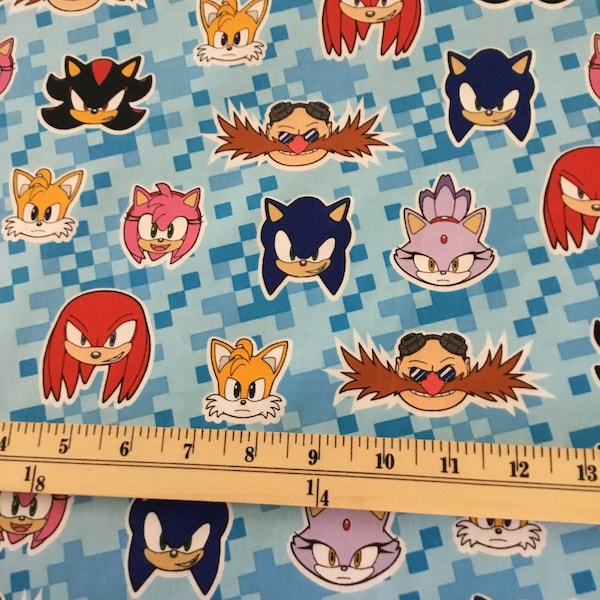 Sonic the Hedgehog on blue Cotton Fabric from Robert Kaufman - 1/2 yd