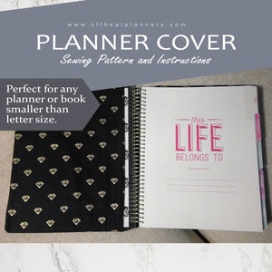 May include: A black planner cover with a gold diamond pattern. The cover is shown open to reveal a white planner with the text "this LIFE BELONGS TO" printed in pink.