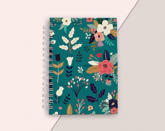 May include: A teal blue spiral bound notebook with a floral pattern. The pattern features white, pink, red, yellow, and blue flowers and leaves.