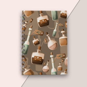 May include: A brown spiral notebook with a pattern of various glass bottles filled with brown, green and pink liquids. Some bottles have a skull and crossbones symbol on them.