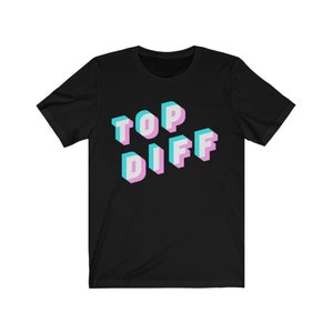 May include: Black t-shirt with a 3D design that says "TOP DIFF" in pink and blue.