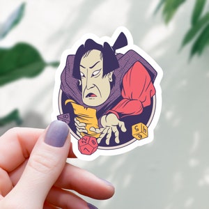 May include: A sticker featuring a cartoon illustration of a person in a red and purple robe holding a scroll and dice. The person has a serious expression and is surrounded by dice.