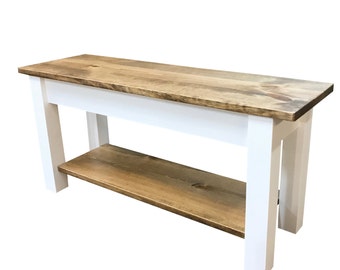 May include: A wooden bench with a natural wood top and shelf, supported by a white base. The bench is approximately 48 inches long, 16 inches deep, and 18 inches high, suitable for entryways or living spaces.