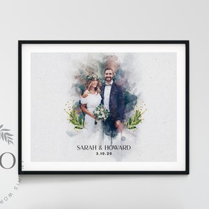 May include: A black framed watercolor painting of a wedding couple standing in front of a watercolor background with green foliage. The text "SARAH & HOWARD 3.10.20" is printed below the couple.