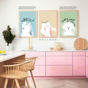 May include: Three framed illustrations of white dogs with text. The first illustration is on a light blue background and says "Ruffled and Not a Care in the World". The second illustration is on a light beige background and says "Best Therapist". The third illustration is on a light green background and says "Love Yourself, even on messy days".