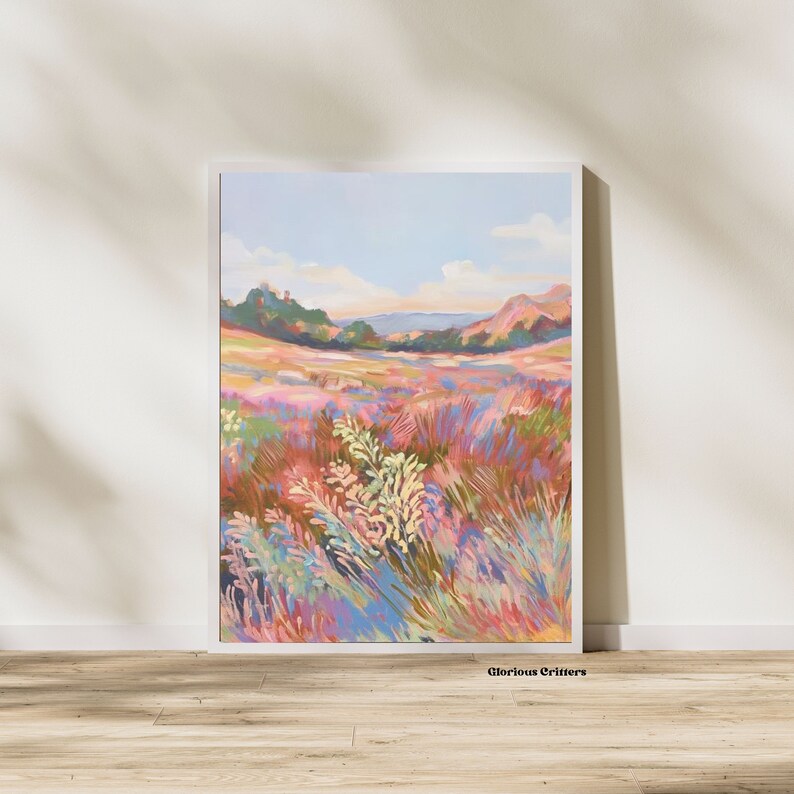 May include: A painting of a field of wildflowers in shades of pink, purple, blue, and green. The field is in the foreground, with a distant landscape of hills and trees in the background. The sky is a light blue with white clouds.