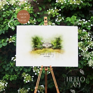 May include: A white sign with a watercolor illustration of a house and the text "Sarah & Kenny 03.10.2022" on an easel in front of a green bush with white flowers.