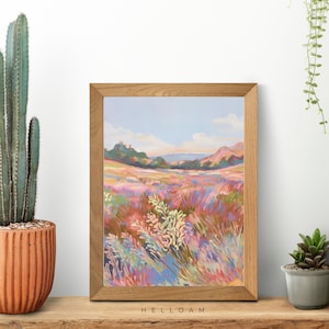 May include: A framed painting of a landscape with a field of colorful wildflowers in the foreground and rolling hills in the background. The sky is a soft blue with white clouds.