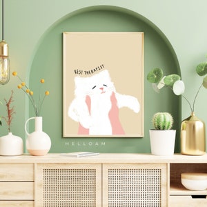 May include: A beige background with a white cat illustration. The cat is being held by two pink hands. The text "BEST THERAPIST" is above the cat. The text "HELLOAM" is below the cat.
