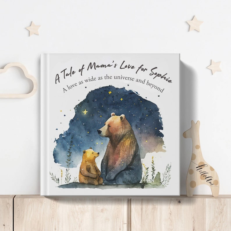 May include: A white book cover with a watercolor illustration of two bears under a starry night sky. The text on the cover reads "A Tale of Mama's Love for Sophie. A love as wide as the universe and beyond."