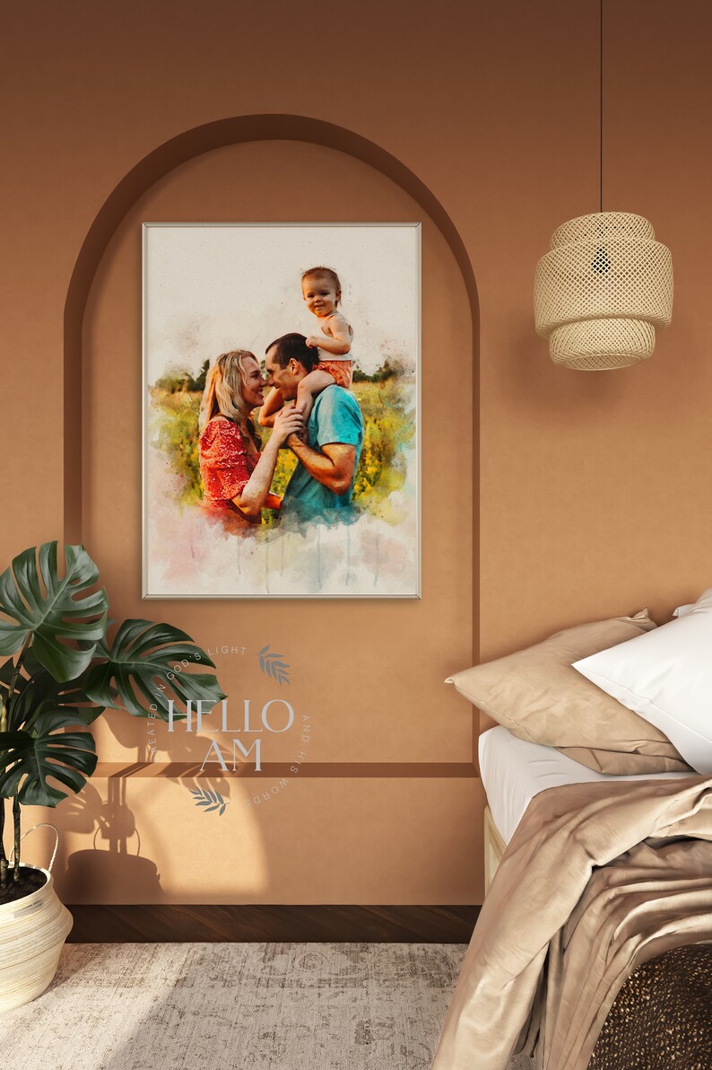 May include: A watercolor painting of a family of three in a field. The father is holding the child on his shoulders, and the mother is standing next to them. The painting is framed in a white frame and hanging on a wall.