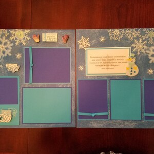 May include: A scrapbook page with a winter theme. The page is decorated with snowflakes, a snowman, and a quote about winter. The page has several photo spaces.
