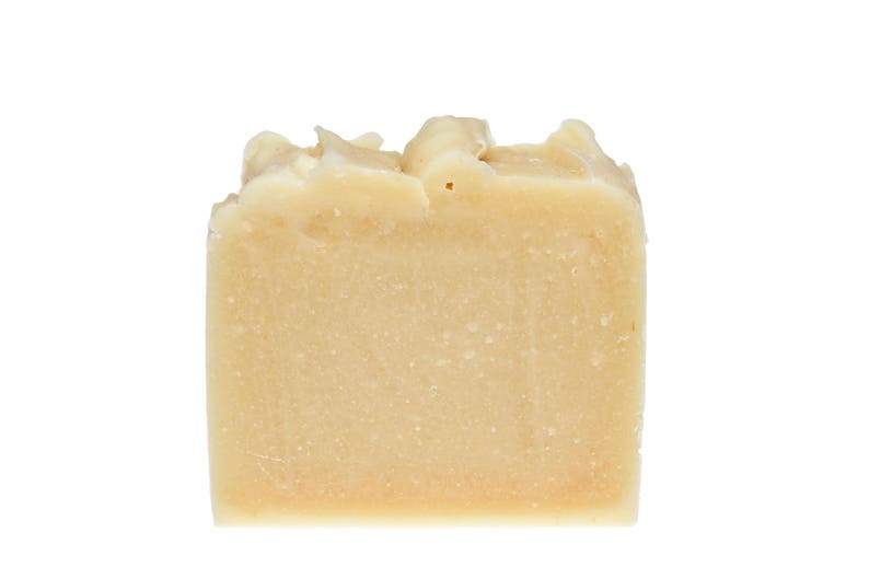 May include: A bar of off-white soap with a slightly rough texture.