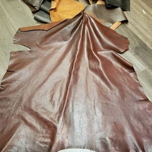 Leather at least 5 to 7 sq.ft.  various colors of goatskin 1.5 -2.0 oz handbag footwear craft skin showroom skins NAT Leathers