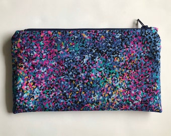 Small speckled print fabric pouch made from quilting cotton with a nylon zipper